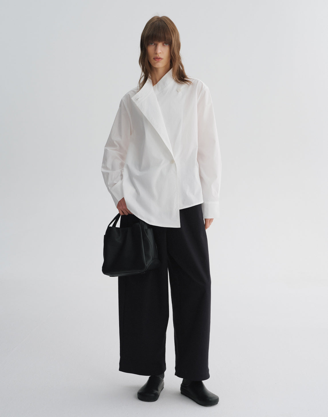 Blouse asymétrique à col en V croisé