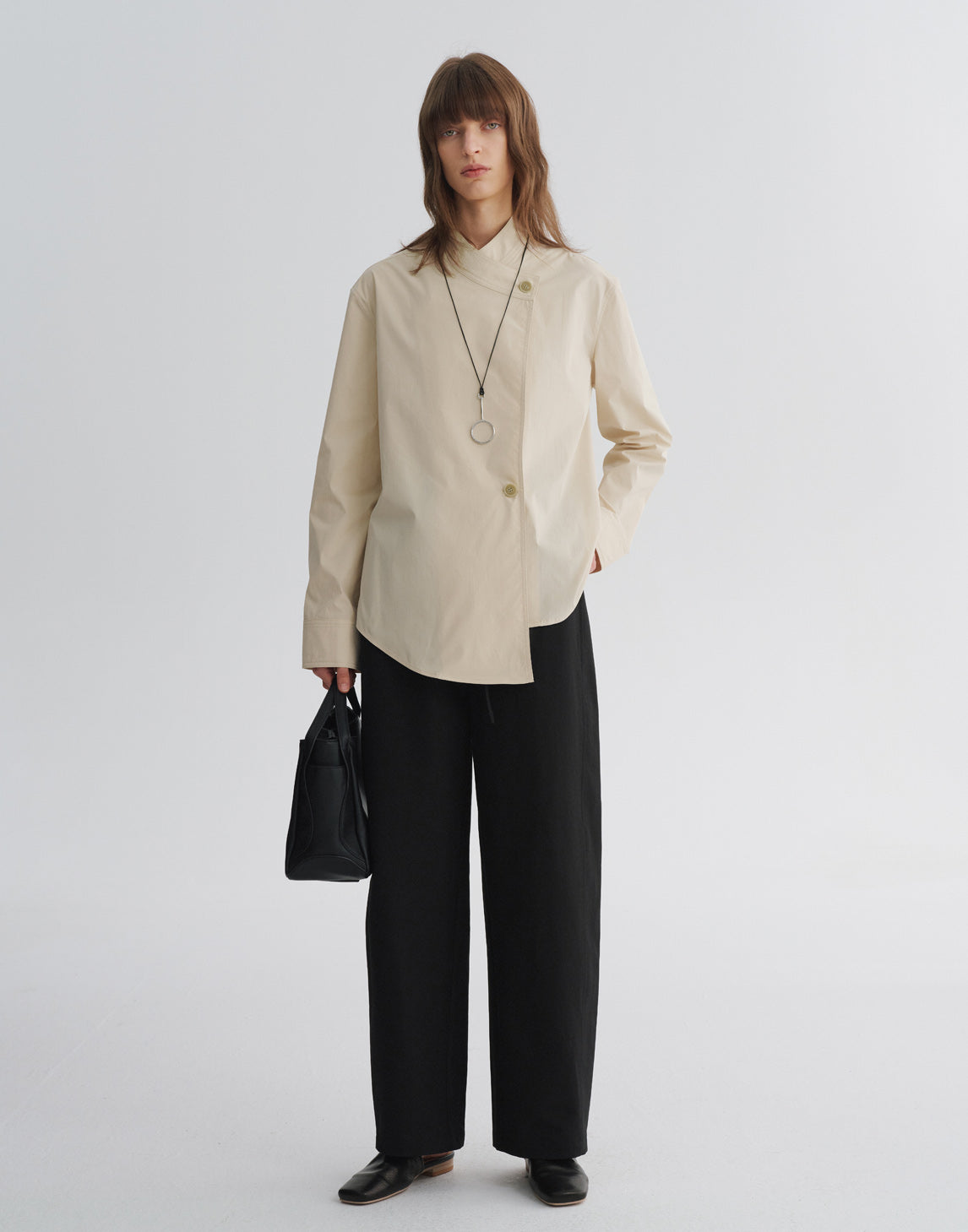 Blouse asymétrique à col en V croisé